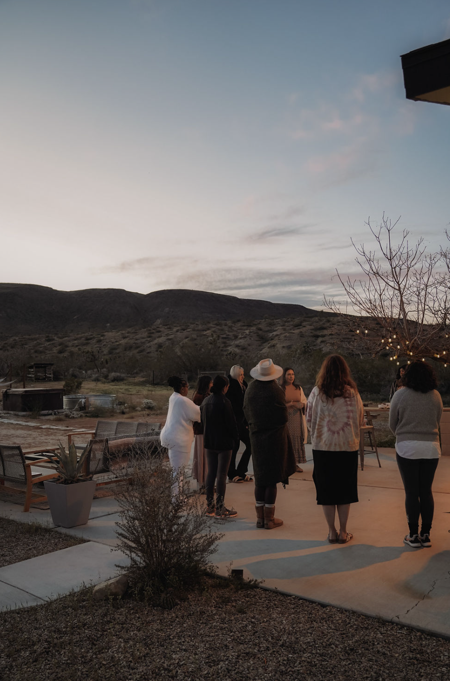 Retreat group at desert sunset